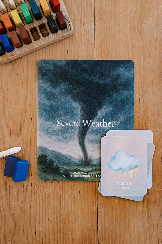 Card on a table with an image of a tornado