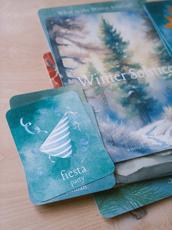 Pages and cards laid out from Acorn School's winter solstice curriculum.