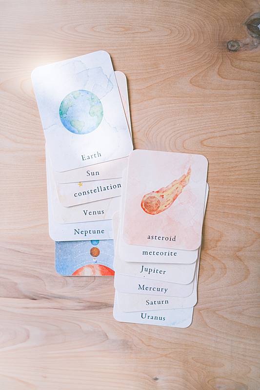 Small cards with planets and asteroids on them