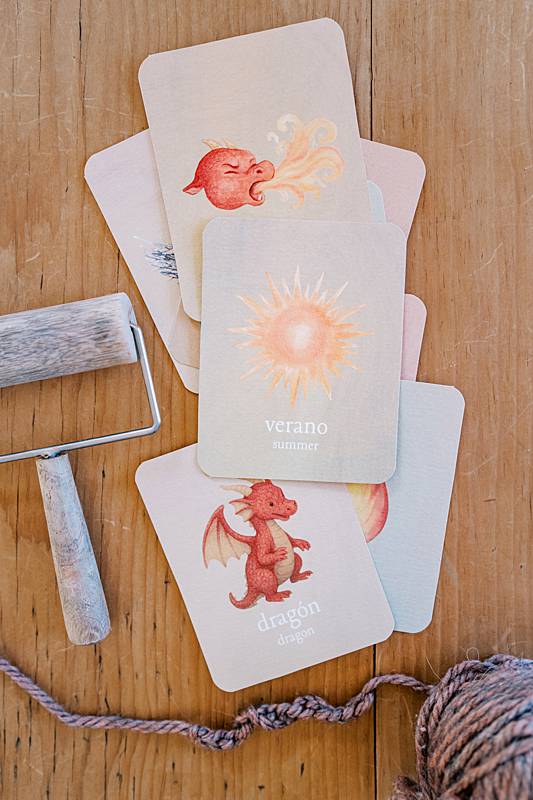 Stack of cards with an image on the sun and a dragon