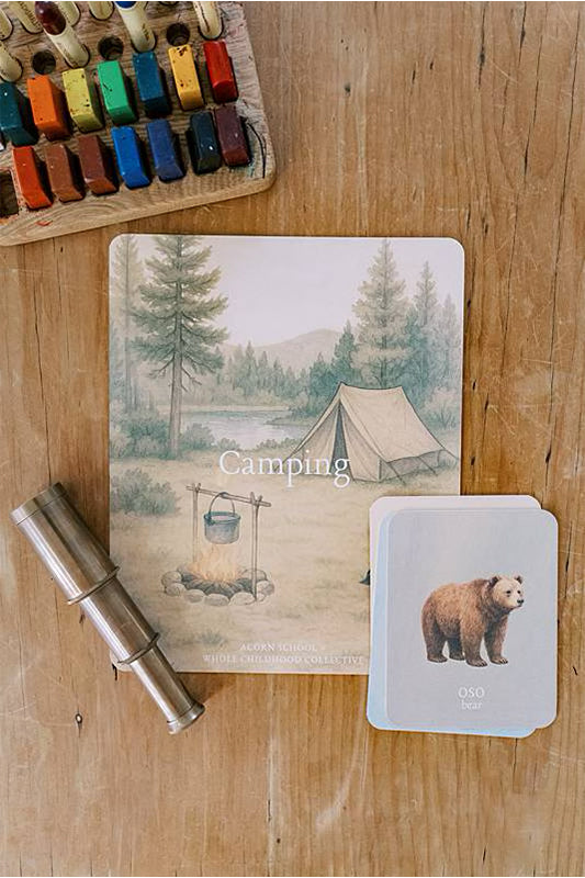 Image of a card with crayons on a wooden table