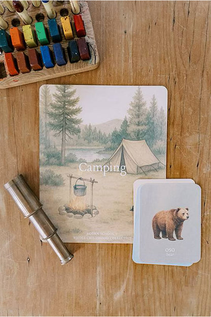 Image of a card with crayons on a wooden table