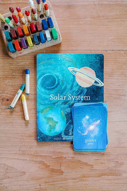 Ccrds with planet illustrations and crayons