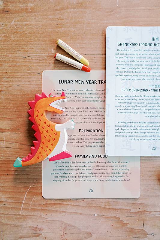 Cards with a dragon toy on them