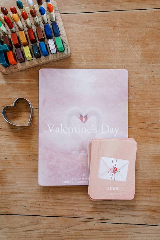 Small and large paper with a heart shaped stencil on a table