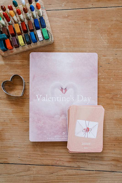 Small and large paper with a heart shaped stencil on a table