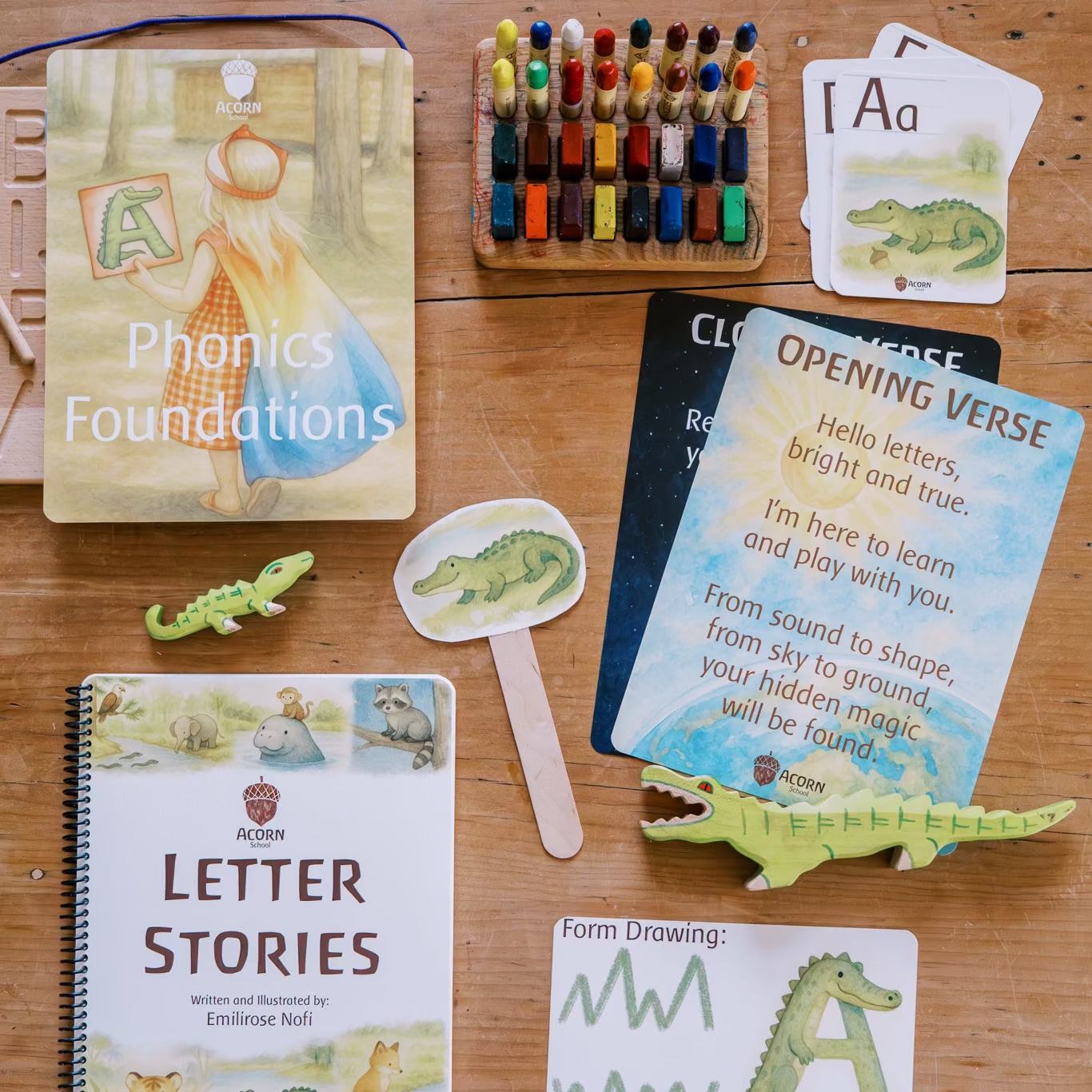 Educational materials for learning phonics and letter recognition on a wooden surface