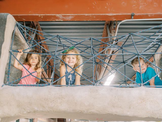 Children playing at the ClimbMax Rock Gym during an Acorn School class.