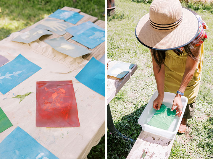 An image of water colored paper and a woman placing the paper in a bucket up Water.