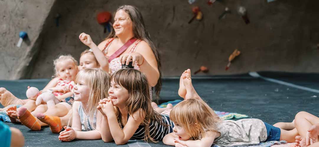 Woman sitting on the flor with children